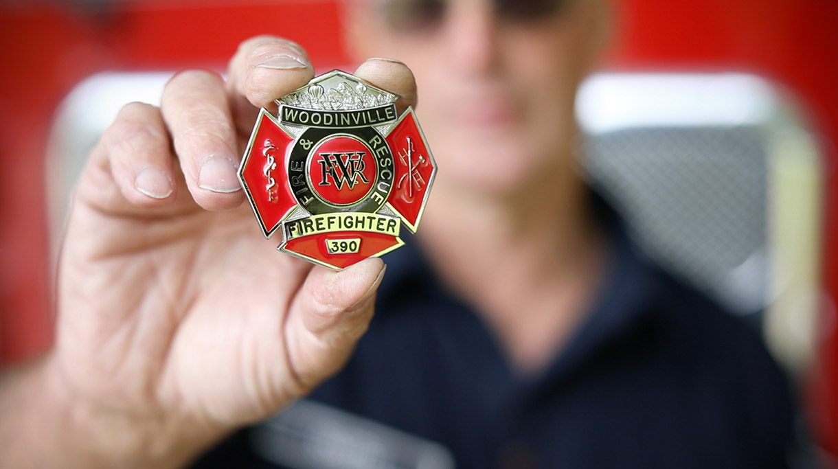 Woodinville Fire and Rescue Badge being held