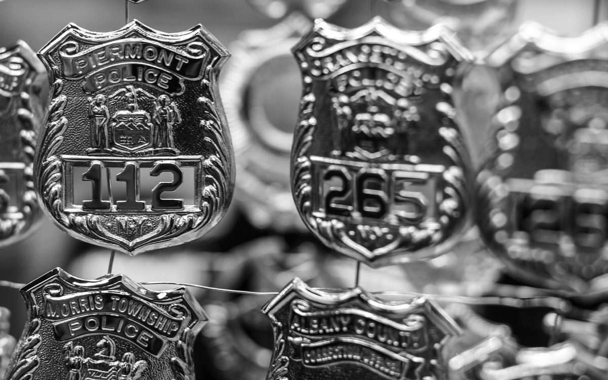 badges in black and white on plating rack