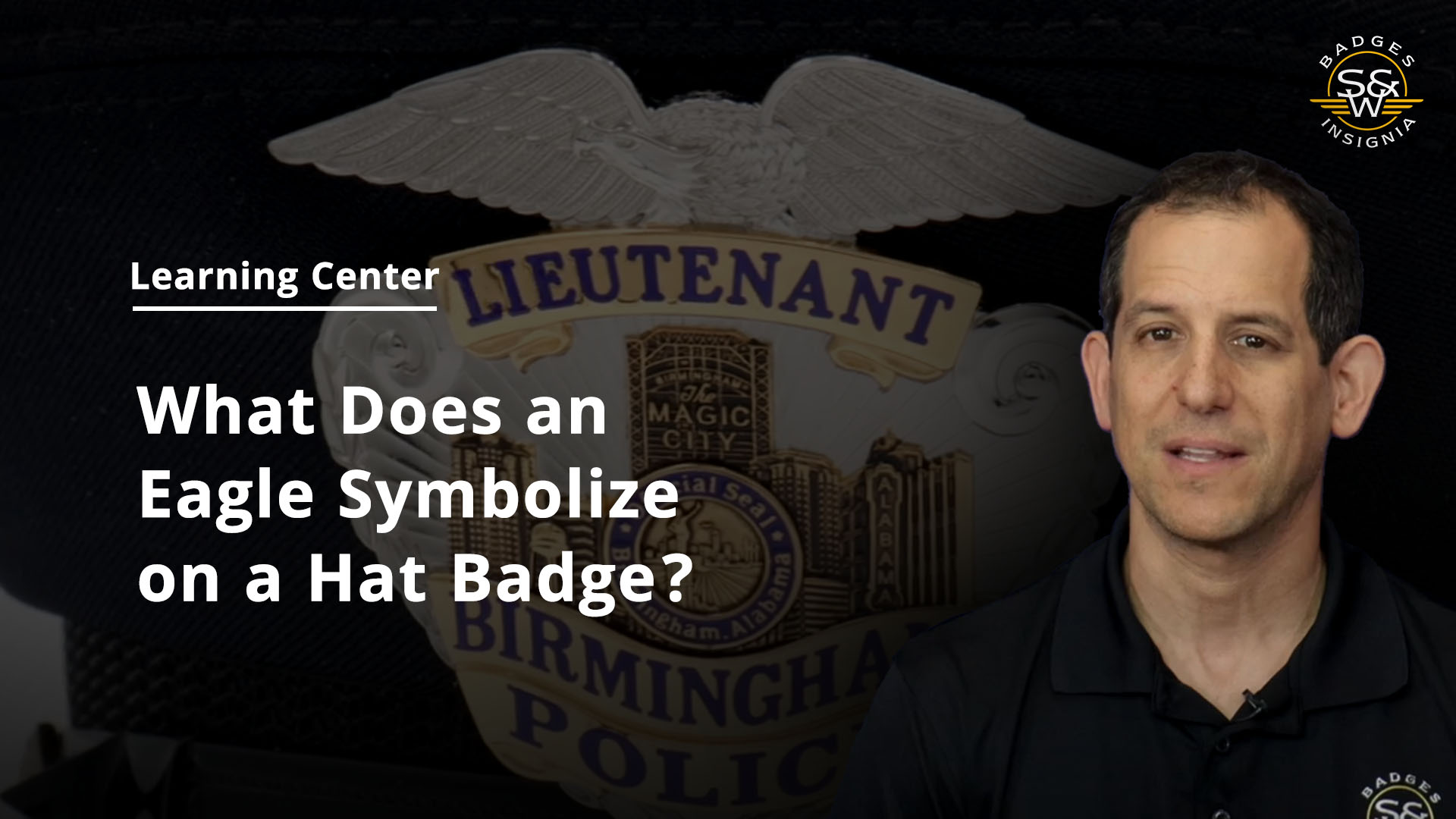 What does an eagle symbolize on a hat badge?